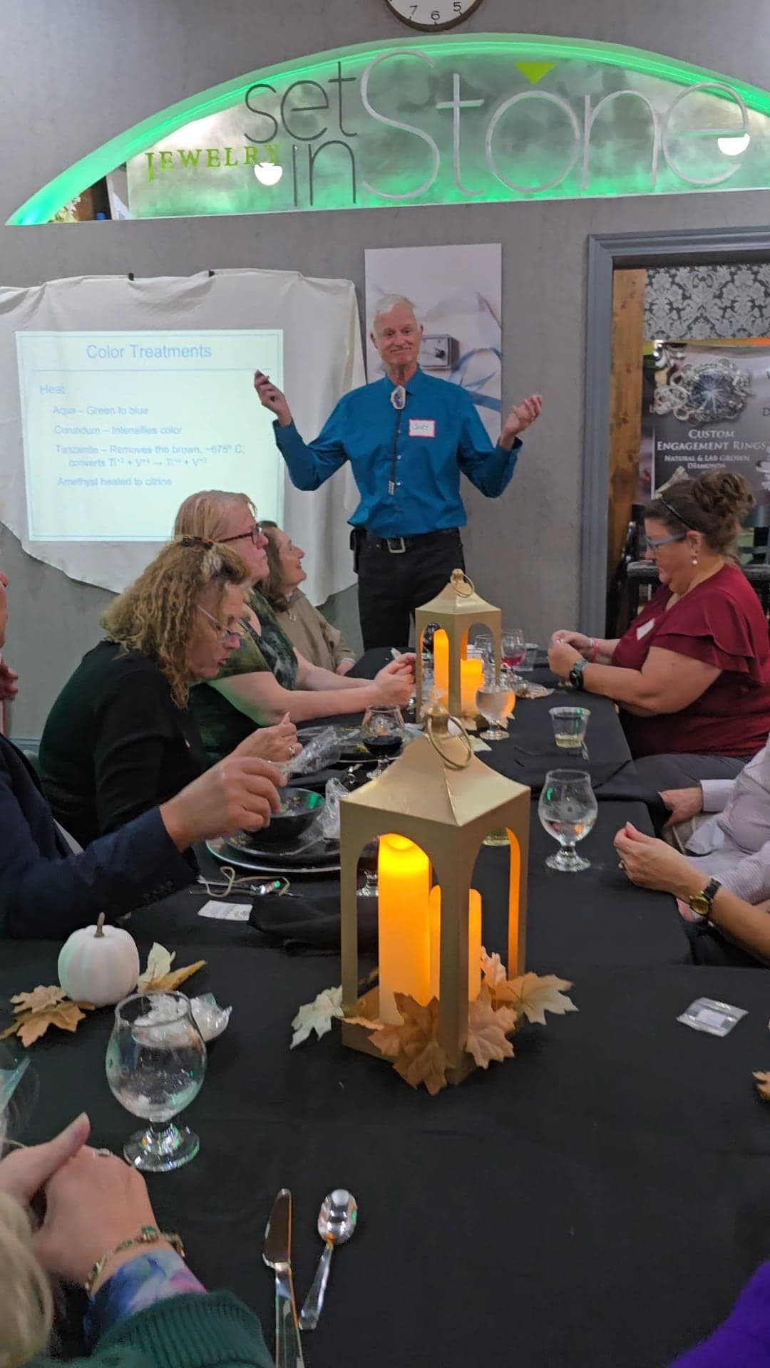 Scott Sucher gestures mid-story during his talk on gemstone color treatments
